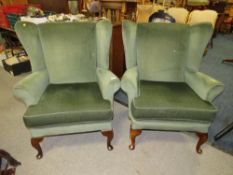 A PAIR OF MODERN UPHOLSTERED WING ARMCHAIRS
