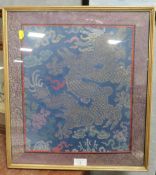 A FRAMED AND GLAZED CHINESE SILKWORK PANEL OF A FIVE TOED DRAGON