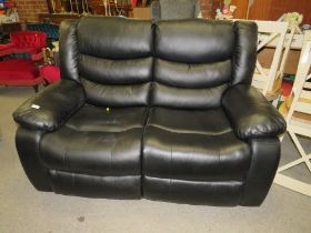 A BLACK TWO SEATER RECLINER SETTEE