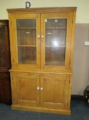 AN ANTIQUE PINE GLAZED HOUSEKEEPERS CUPBOARD - H 210 cm, W 132 cm