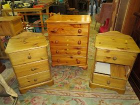 A HONEY PINE FOUR DRAWER CHEST TOGETHER WITH BEDSIDES AND TOWEL RAIL