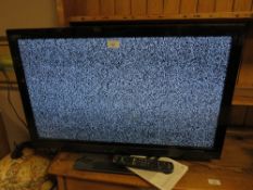 A PANASONIC 31" FLATSCREEN TV WITH REMOTE