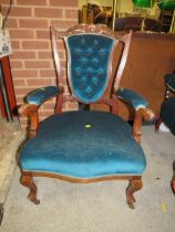 AN EDWARDIAN MAHOGANY UPHOLSTERED ARM CHAIR