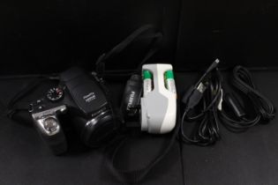 A FUJI FINEPIX DIGITAL CAMERA AND ACCESSORIES