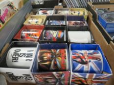 A TRAY OF TWELVE NEW BOXED POP MUSIC RELATED MUGS TO INCLUDE THE WHO, IRON MAIDEN, KINGS OF LEON,