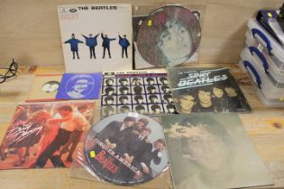 A SELECTION OF LP RECORDS AND 7" SINGLES TO INCLUDE BEATLES ' CONQUER AMERICA ' PICTURE DISC,