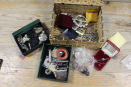 A BASKET OF COLLECTABLES TO INCLUDE ENAMEL CLIPS, BELT BUCKLES, HALLMARKED SILVER ETC
