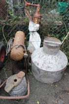 A VINTAGE COMPRESSOR WITH A HAND PUMP PLUS A ROLL OF BARBED WIRE AND A VINTAGE METAL URN