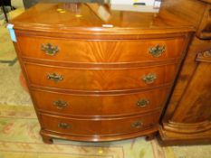 A WALNUT BOW FRONTED FOUR DRAWER CHEST - W 79 cm
