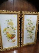A PAIR OF VICTORIAN GILT FRAMED FLORAL PAINTINGS ON GLASS (2)