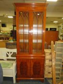 A REPRODUCTION YEW SLIM GLAZED CABINET / BOOKCASE - H 206 cm, W 79 cm