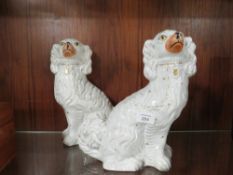 A PAIR OF STAFFORDSHIRE SPANIELS A/F