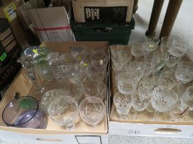 TWO TRAYS OF GLASSWARE TO INCLUDE DRINKING GLASSES , CANDLESTICKS ETC