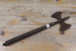 A VINTAGE STYLE WOODEN HANDLED DECORATIVE TWIN BLADED AXE WITH GRIFFIN TYPE EMBELLISHMENT