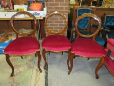 A SET OF THREE MAHOGANY CARVED DINING CHAIRS