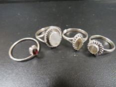 A COLLECTION OF FOUR 925 SILVER GEMSTONE DRESS RINGS TO INC GARNET, CITRINE, MOONSTONE ETC