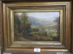 G. WILLIS-PRYCE AN OIL ON CANVAS DEPICTING CATHEDRAL RUINS IN A VALLEY 19 X 29CM