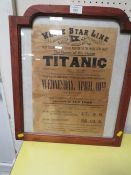 A FRAMED AND GLAZED REPRODUCTION POSTER OF TITANIC