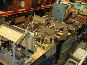 TWO TABLE TOPS CONTAINING A HUGE SELECTION OF VARIOUS DISMANTLED VALVE RADIO CHASSIS AND OTHER AUDIO