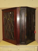 A 19TH CENTURY MAHOGANY GLAZED HANGING CORNER CABINET (2)