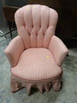 A VINTAGE UPHOLSTERED SMALL ARMCHAIR