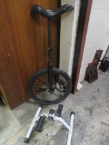A UNICYCLE AND EXERCISE PEDELAR