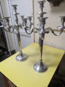 A PAIR OF POLISHED METAL CANDELABRA