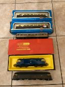 BOXED AND UNBOXED DIESEL LOCOMOTIVES BOTH HORNBY, TOGETHER WITH THREE COACHES - TWO OF WHICH ARE