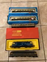 BOXED AND UNBOXED DIESEL LOCOMOTIVES BOTH HORNBY, TOGETHER WITH THREE COACHES - TWO OF WHICH ARE