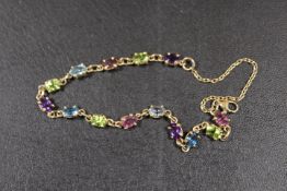 A 375 STAMPED GOLD BRACELET SET WITH MULTI-COLOURED STONES