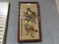 A BAMBOO EFFECT FRAMED JAPANESE TWIN TILE IMAGE OF A SAMURAI WARRIOR SIGNED LOWER RIGHT