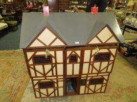 A LARGE COUNTRY HOUSE STYLE JACOBEAN DOLLS HOUSE WITH SOME FURNITURE - H 122 cm, W 117 cm