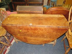 A LARGE OAK DROPLEAF GATELEG TABLE