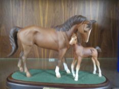 A ROYAL DOULTON CERAMIC MARE AND FOAL STUDY ENTITLED 'FIRST BORN' - MARKED AS A SECOND