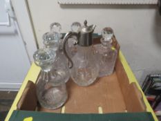 A TRAY OF ASSORTED DECANTERS ETC