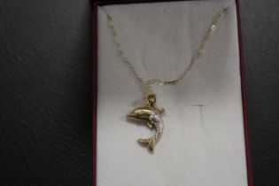 A 9CT GOLD DOLPHIN PENDANT