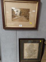 A FRAMED AND GLAZED MAP OF STAFFORDSHIRE TOGETHER WITH A WATERCOLOUR OF A CHURCH SCENE