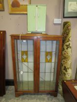 A VINTAGE OAK GLAZED BOOKCASE AND PAINTED CABINET (2)