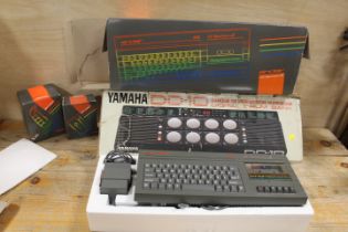 A SINCLAIR 128K ZX SPECTRUM +2 TOGETHER WITH A YAMAHA DD-10 DIGITAL DRUM BANK