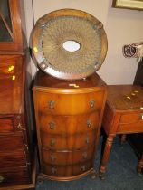 A SMALL FIVE DRAWER WALNUT BOWED CHEST PLUS AN OAK WICKER STOOL (2)