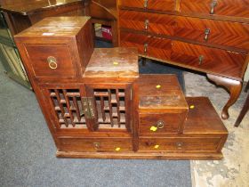 A COLONIAL STYLE STEPPED CABINET