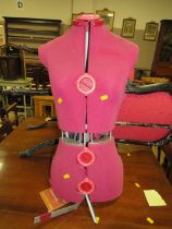 A VINTAGE DRESSMAKERS DUMMY