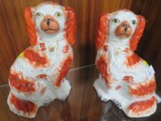 A PAIR OF STAFFORDSHIRE FLATBACK STYLE SPANIELS