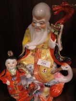 A MODERN CERAMIC TABLEAU OF A CHINESE DEITY