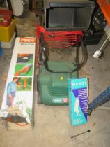 A POWERED QUALCAST SCARIFIER / RAKE TOGETHER WITH A BOXED FLYMO STRIMMER ETC