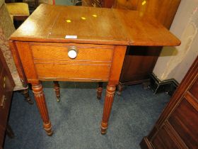 A WILLIAM IV OAK DROPLEAF OCCASIONAL TABLE ON FLUTED LEGS