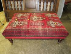 AN ANTIQUE LARGE UPHOLSTERED STOOL 105 x 65 cm