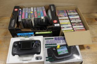 A SEGA GAME GEAR HAND HELD GAME SYSTEM AND GAMES - UNCHECKED