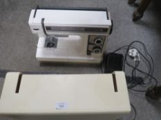 A VINTAGE NEW HOME ELECTRIC SEWING MACHINE