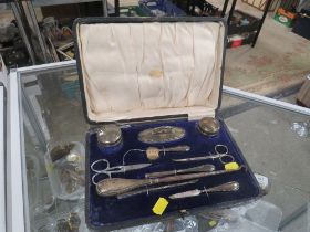 A CASED VANITY / MANICURE SET WITH HALLMARKED SILVER EXAMPLES AND SOME REPLACEMENTS